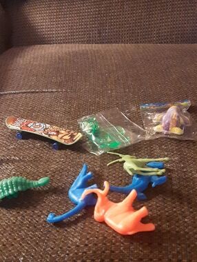 Mini Toy Skateboard and Assorted Plastic Dinosaurs - Blue, Orange, Green